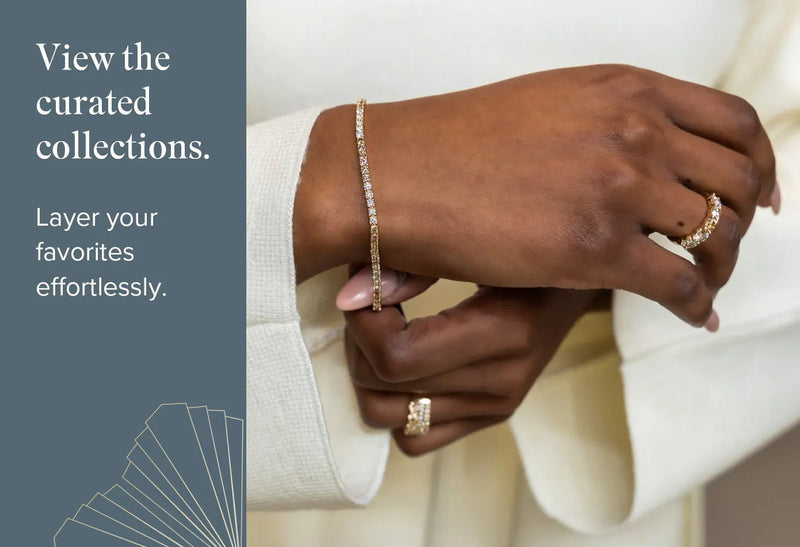 Close-up of hands wearing gold rings and a bracelet with text on a blue background
