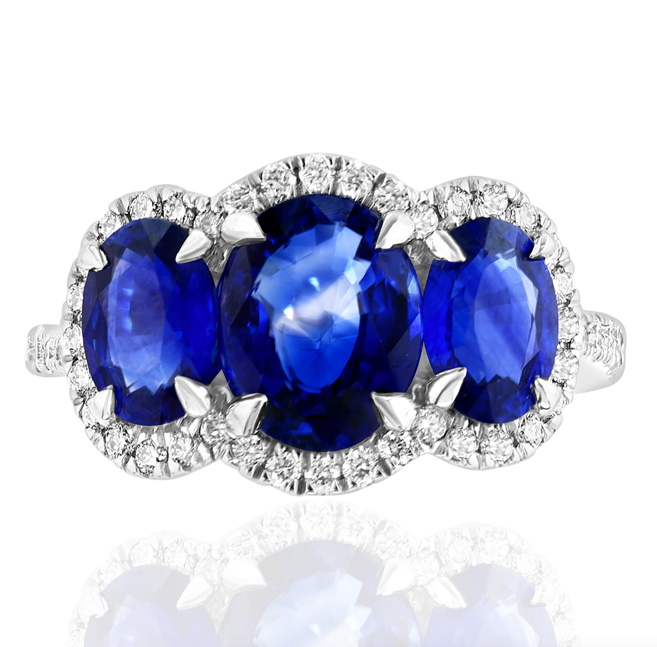 Platinum Sapphire 3-Stone Ring with Diamond Halo